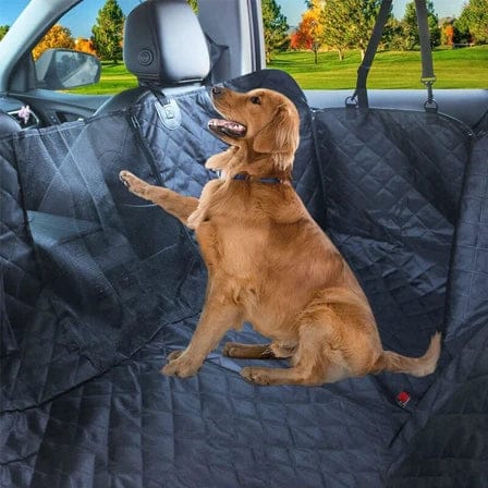 Golden Retriever on a waterproof dog car seat cover in a vehicle.